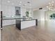 Bright kitchen with a large island and stainless appliances open to a spacious living area at 6907 Kelp Ledge Ct, Las Vegas, NV 89131