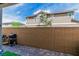 Private backyard space features a brick wall and cozy grilling area at 694 Last Dance Pl, Henderson, NV 89011