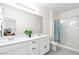 Bathroom with double sink vanity and glass-enclosed shower at 694 Last Dance Pl, Henderson, NV 89011