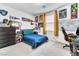 This bedroom has carpet, natural light, and room for both sleeping and studying at 694 Last Dance Pl, Henderson, NV 89011
