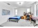 Bedroom with carpet, desk, chair, and natural light streaming through the windows at 694 Last Dance Pl, Henderson, NV 89011