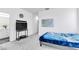 Bedroom featuring carpet, a TV, and natural light from the windows at 694 Last Dance Pl, Henderson, NV 89011