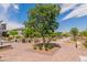 Beautifully landscaped community area features paved walkways, seating areas, and lush greenery for residents to enjoy at 694 Last Dance Pl, Henderson, NV 89011
