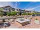 The community firepit is surrounded by comfortable seating at 694 Last Dance Pl, Henderson, NV 89011