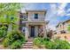 Inviting two-story home featuring a landscaped yard and a charming front entrance at 694 Last Dance Pl, Henderson, NV 89011