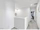 Bright hallway featuring neutral walls and carpet leading to various rooms in the home at 694 Last Dance Pl, Henderson, NV 89011