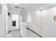 Hallway featuring neutral walls and carpet and decorative houseplants at 694 Last Dance Pl, Henderson, NV 89011