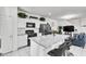 Bright kitchen boasts granite countertops, black appliances, and a breakfast bar for casual dining at 694 Last Dance Pl, Henderson, NV 89011