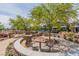 The community picnic area has tables and mature landscaping at 694 Last Dance Pl, Henderson, NV 89011