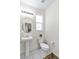 Clean powder room includes a pedestal sink, updated toilet, and neutral decor at 694 Last Dance Pl, Henderson, NV 89011