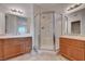 Bathroom with double sinks, vanity, shower and tile flooring at 7701 W Robindale Rd # 206, Las Vegas, NV 89113
