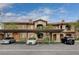Beautiful building exterior with covered parking, nice landscaping, and visible unit numbers for easy navigation at 7701 W Robindale Rd # 206, Las Vegas, NV 89113