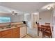 The kitchen features a dishwasher, appliances, and seamless connectivity to the dining area for modern living at 7701 W Robindale Rd # 206, Las Vegas, NV 89113
