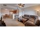 Open-concept living and dining area featuring carpet, stylish seating, and seamless flow to the kitchen at 7701 W Robindale Rd # 206, Las Vegas, NV 89113