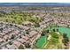 Panoramic aerial view of a community with a golf course, lakes, and desert landscaping at 7720 Fruit Dove St, North Las Vegas, NV 89084