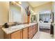 Well-lit bathroom features double sinks, granite countertops, and modern faucets at 7720 Fruit Dove St, North Las Vegas, NV 89084