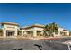 Exterior view of a community building with well-maintained landscaping and ample parking at 7720 Fruit Dove St, North Las Vegas, NV 89084