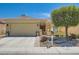 Charming single-story home with a well-manicured lawn and a two-car garage at 7720 Fruit Dove St, North Las Vegas, NV 89084