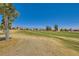 Picturesque golf course with mature trees and mountain views in the distance at 7720 Fruit Dove St, North Las Vegas, NV 89084