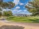 Scenic view of a lush golf course with mountain backdrop at 7720 Fruit Dove St, North Las Vegas, NV 89084