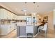 Modern kitchen featuring white cabinetry, granite countertops, and stainless steel appliances at 7720 Fruit Dove St, North Las Vegas, NV 89084