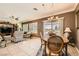 Inviting living room and dining area with tile flooring and plenty of natural light at 7720 Fruit Dove St, North Las Vegas, NV 89084