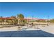 Outdoor lounge area features tables and umbrellas with mountain views at 7720 Fruit Dove St, North Las Vegas, NV 89084