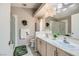 Bright bathroom with double sinks, neutral finishes, and a glass-enclosed shower at 7900 Ryandale Cir # 201, Las Vegas, NV 89145