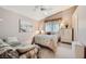 Cozy bedroom featuring a comfortable sitting area and ample natural light at 7900 Ryandale Cir # 201, Las Vegas, NV 89145