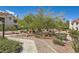 Well-maintained community grounds feature walkways, mature trees, shrubs, and desert landscaping at 7900 Ryandale Cir # 201, Las Vegas, NV 89145
