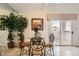 Bright dining area near the balcony features tile flooring, mirrored wall, and stylish seating at 7900 Ryandale Cir # 201, Las Vegas, NV 89145