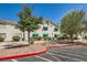 Charming condo exterior featuring well-maintained landscaping, covered windows, and convenient parking spaces at 7900 Ryandale Cir # 201, Las Vegas, NV 89145