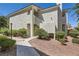 Attractive condo featuring manicured landscaping and a private entrance under a bright, clear sky at 7900 Ryandale Cir # 201, Las Vegas, NV 89145