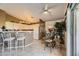 Bright kitchen area with white cabinets, stainless steel appliances, and counter seating at 7900 Ryandale Cir # 201, Las Vegas, NV 89145