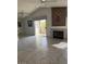 Spacious living room includes a fireplace, sliding door to a deck, and large tile floors at 7900 Ryandale Cir # 201, Las Vegas, NV 89145