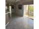 Bright living room features tile floors, fireplace, and sliding doors to balcony at 7900 Ryandale Cir # 201, Las Vegas, NV 89145