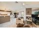 This living room has a fireplace, balcony, breakfast bar, and tile floors at 7900 Ryandale Cir # 201, Las Vegas, NV 89145
