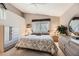 Neutral bedroom featuring a vaulted ceiling, soft lighting, and tasteful decor at 7900 Ryandale Cir # 201, Las Vegas, NV 89145