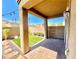 A backyard with desert landscaping, string lights, a patio, and block wall fencing at 81 Sertata Ct, Henderson, NV 89074