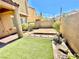 Outdoor patio featuring artificial turf, a patio, and a block wall fence at 81 Sertata Ct, Henderson, NV 89074