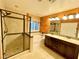 Well-lit bathroom features double vanity, separate tub and glass-enclosed shower at 81 Sertata Ct, Henderson, NV 89074