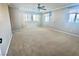 This bedroom has carpet and fan with window shades providing privacy and light control at 81 Sertata Ct, Henderson, NV 89074