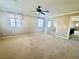 This bedroom has carpet and a fan, with a closet and views to other spaces at 81 Sertata Ct, Henderson, NV 89074