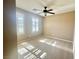 Bedroom featuring plantation shutters, a ceiling fan, and neutral decor at 81 Sertata Ct, Henderson, NV 89074