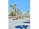 Community entrance featuring fountain, mature palms, and manicured landscaping at 81 Sertata Ct, Henderson, NV 89074