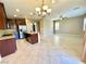 Spacious kitchen features granite counters, stainless appliances and an island with pendant lighting at 81 Sertata Ct, Henderson, NV 89074