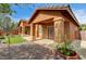 Charming single-story home with a covered patio, stucco exterior, and manicured landscaping at 900 Royal Plum Ln, Las Vegas, NV 89144