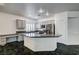 Well-equipped kitchen with stainless steel appliances, granite countertops, ample cabinetry, and a central island at 900 Royal Plum Ln, Las Vegas, NV 89144
