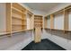 Well-organized walk-in closet with built-in shelving and drawers to maximize storage space at 900 Royal Plum Ln, Las Vegas, NV 89144