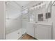 Well-lit bathroom featuring a glass shower door and ample counter space at 10617 Tuckermans Ave, Las Vegas, NV 89129